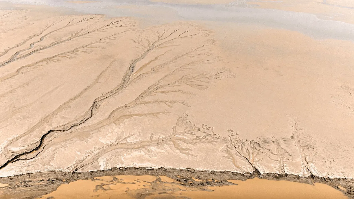Aerial image showcasing the intricate patterns of a sandy river delta in Hangzhou.
